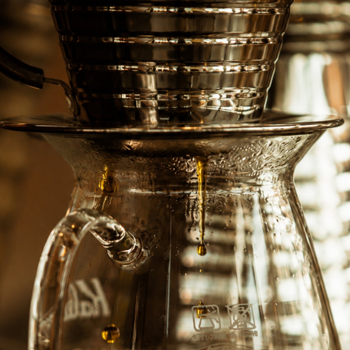 Framed close-up pour-over coffee photography from Slow Drip displayed in a contemporary interior