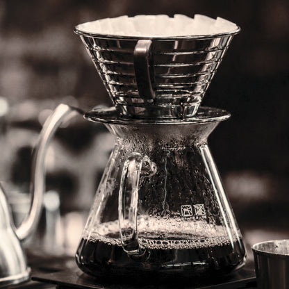 Framed minimal coffee brewing photography from The Pour displayed in a contemporary interior