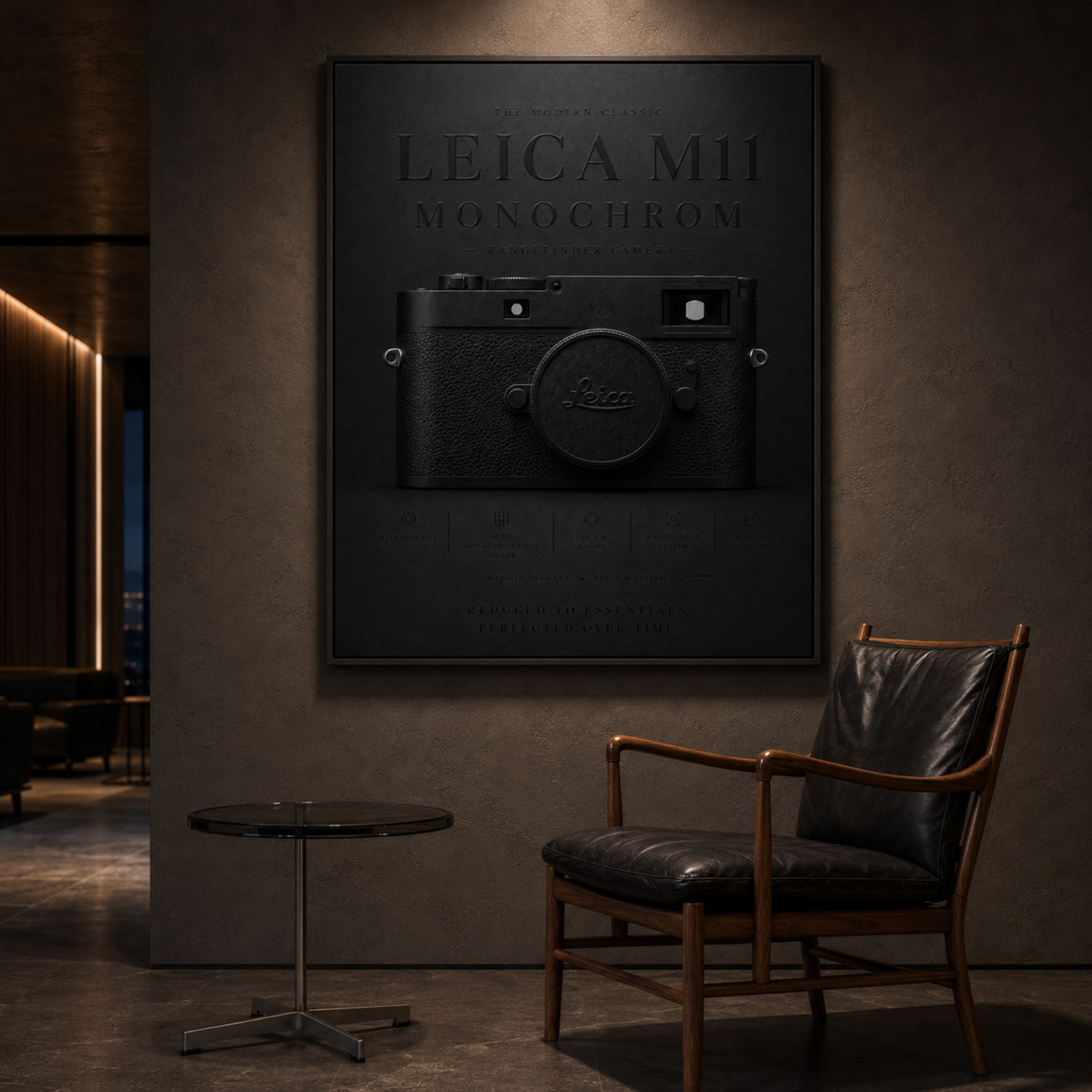 Framed Leica M11 Monochrom camera wall artwork displayed in a modern interior with a black chair